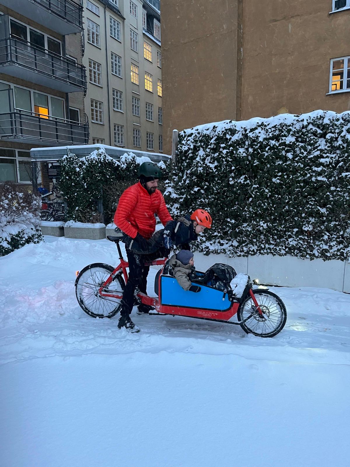 Brother and sons in the snow